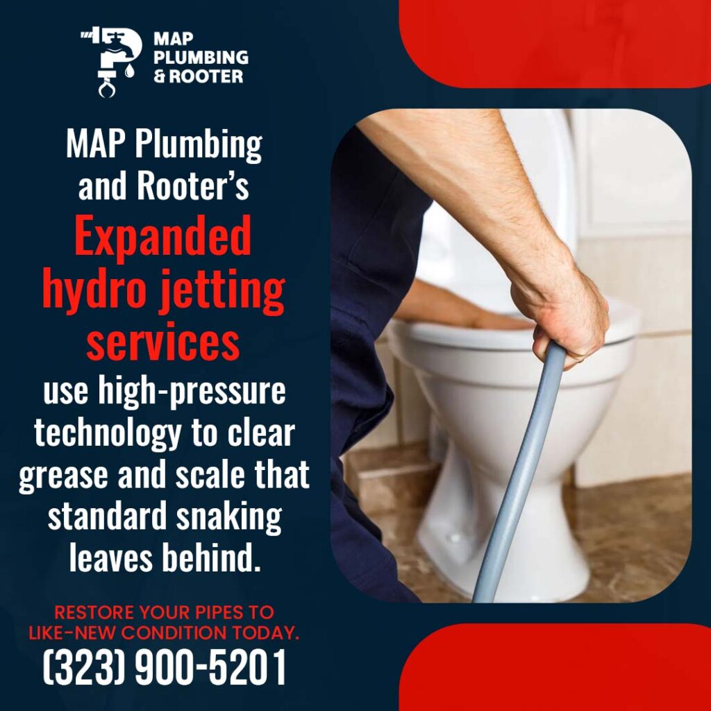 Plumber clearing a clogged toilet drain with hydro jetting and drain cleaning equipment for MAP Plumbing and Rooter in Los Angeles